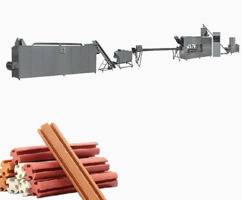 La macchina progettata dell'ossequio dell'animale domestico ha espulso cane che mastica la trasformazione dei prodotti alimentari