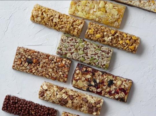 Macchina per la produzione continua e automatica di barrette di cereali al sesamo, macchina per chikki alle arachidi